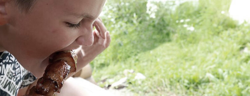 Kid Eating Chop Image